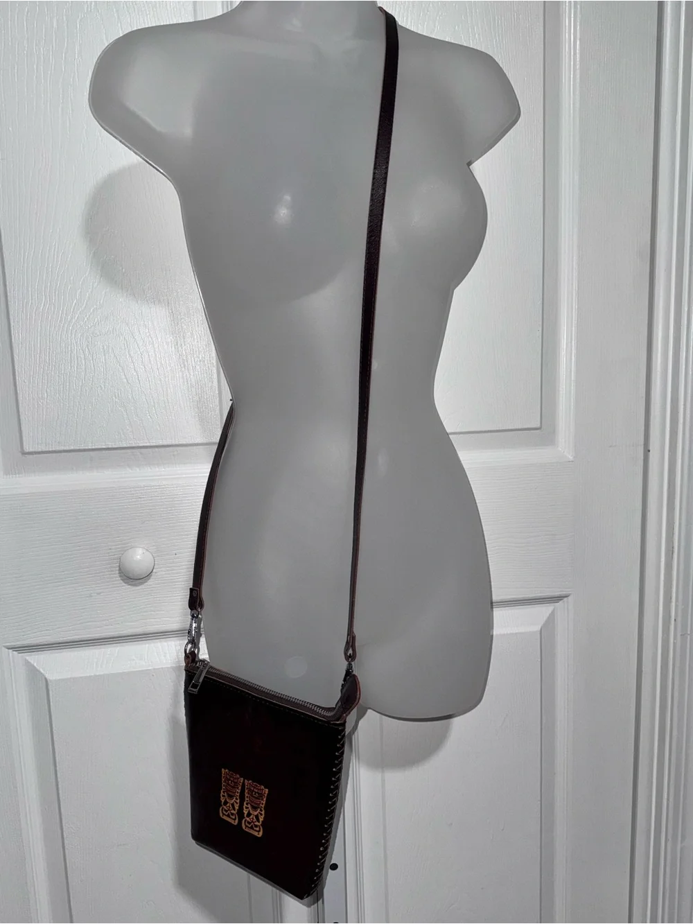 Dark Brown Leather Crossbody Bag with Embossed Tiki Design from Hawaii